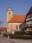 Kirche St. Dionysius in Ettlingenweier mit Fachwerkhaus – Umfeld des Café Gringel Büro Olpp – Designstudio Leipzig
